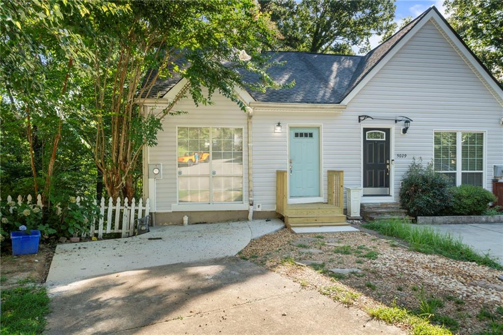 Unique Townhome tucked away in a quiet cul-de-sac, this move-in-ready townhome offers privacy and unbeatable convenience. Enjoy your morning coffee on the multi-level back deck overlooking a peaceful, tree-lined creek—complete with a private trail for nature walks right from your backyard. Feels like living in a treehouse! Perfect for entertaining. Inside, you'll find an enormous picture window in the kitchen that brings in tons of natural light, LVP flooring throughout (no carpet!), a bright and airy layout with lots of windows, and a white brick fireplace as the cozy focal point. The ideal roommate floorplan provides both comfort and flexibility. One bed and bath upstairs, one bed and bath downstairs with kitchen and living area in between. Located just 10 minutes from Truist Park and The Battery with NO RENT RESTRICTIONS! this home is a fantastic opportunity for homeowners and investors alike. Easy access to major highways, shopping, dining, parks, Silver Comet Trail and schools add to the appeal. 20 minutes to downtown Atlanta, 30 minutes to airport. Whether you're looking for a peaceful retreat or a savvy investment—this home checks all the boxes!