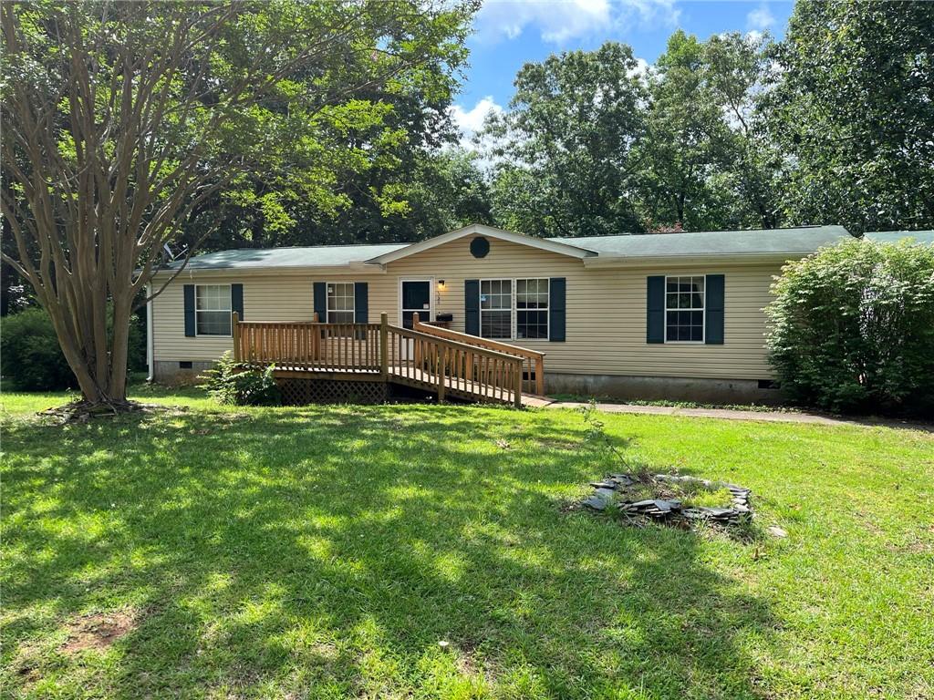 Move in ready fixer upper in Jasper. Double wide manufactured home with detached 2 car garage. Home will need some work but in livable condition. Great little lot towards end of the street with additional storage shed in back. All tile walk in master shower. All utilities on and central HVAC. Will mostly need cosmetic work. Strong rental market in area. On permanent foundation. Sold as is with no disclosures. Cash offers only.