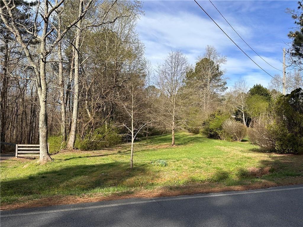10 ACRES Ready to Build your DREAM HOME in highly desirable location. East High School District. Private 10 acres with cleared lot space to build. Property backs up to Lanierland Park for great access to amenities. Well on property. Water and Sewer available at street.