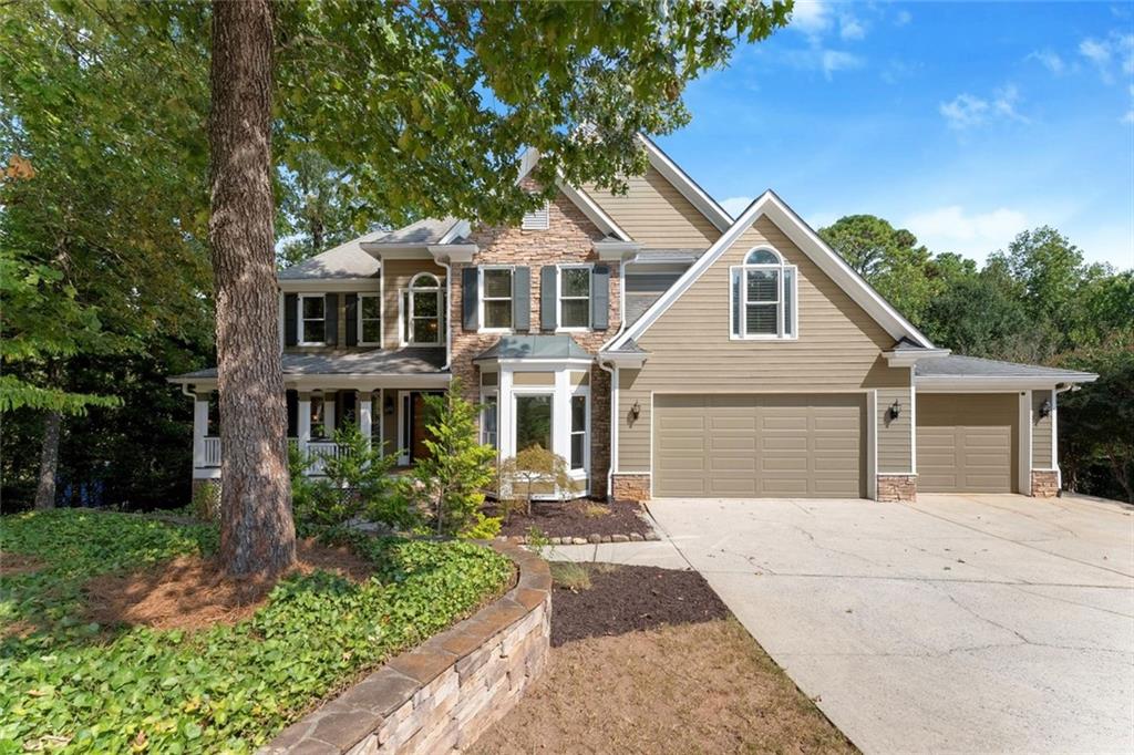 $10,000 Buyer Bonus with an accepted offer by October 18th, 2025!
Impeccably maintained Hardage Farm showstopper with awe-inspiring Kennesaw Mountain views! Perfectly situated on a cul-de-sac lot in the highly desirable West Side Elementary School District, this move-in ready home features 4 bedrooms, 3.5 baths, and a full finished daylight basement. Recent upgrades include a brand-new HVAC, new water heater, fresh landscaping, new carpet and paint.
Step inside to find gleaming hardwood floors and a soaring two-story fireside great room. The chef’s kitchen impresses with custom Thomasville cabinetry, Wolf gas range and hood, paneled appliances, luxurious granite counters. Upstairs, four bedrooms offer plush carpet, custom Elfa closets, and glorious mountain views. The primary retreat boasts a renovated bath with dual marble vanities, soaking tub, and separate shower.
Enjoy multiple outdoor living spaces — two decks, a screened porch, and a covered patio — all designed to take in the breathtaking scenery of Kennesaw Mountain National Park. The finished terrace level expands the living space with a full bath, kitchenette, private bar, optional 5th bedroom, recreation area, and family room. Neighborhood amenities include a clubhouse, pool, tennis, pickleball, playground, and fishing pond, plus direct access to Kennesaw Mountain Battlefield Trails. Minutes to Marietta Square, Marietta Country Club, and The Avenues. Live your best Marietta lifestyle today!
