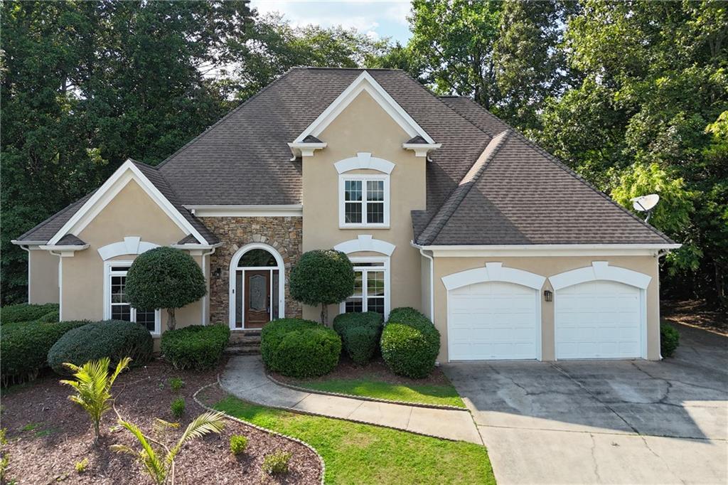 Welcome to this stunning and luxurious 6-bedroom, 4.5-bathroom fully renovated top to bottom in the most highly desirable Vinings Glen community. Absolutely stunning. House sits on a cul-de-sac, surrounded with the most amazing neighbors you could dream of. A thriving community known for its charm and vibrant lifestyle. This spacious house offers a perfect blend of comfort and luxury. You will fall in love with this home the second you lay your eyes on it. The front mahogany door and the amazing chandelier offer a luxurious entrance. The stunning hardwood floors offer a comfortable feel. The brand-new windows allow the natural light to flow throughout the entire home. Downstairs you will be faced with an amazing staircase and custom iron railing. You will also find a welcoming dining room, a large library, and an oversized family room with a stunning fireplace ideal for gatherings. The well-appointed new kitchen “all high-end wood material with no filling” boasts a large island, perfect for culinary creations, and opens to a dining area overlooking a sizable deck—perfect for outdoor dining and relaxation. There's also a convenient laundry room with a sink and a large pantry across from it. In addition, there is a wet bar area ideal for entertaining. The master bedroom is conveniently located on the main level, featuring a spacious layout and a luxurious bathroom with two separate vanities and two separate walk-in closets, both his and hers, a glass-enclosed shower with built-in shower system, and a relaxing oversized bathtub—a private retreat within your own home. Upstairs, you'll discover 4 bedrooms, one with an en-suite bathroom and 2 other bedrooms with access to a Jack and Jill bathroom featuring dual vanities—perfect for family or guests. Each room offers comfort and privacy, designed with modern living in mind. The basement level adds even more to this impressive home, featuring a full kitchen with an island and dining area, a full bedroom and bathroom, and a large living room—ideal for a movie theater or entertainment area. Outside, a large cement patio provides additional space for outdoor activities and relaxation. Smyrna, Georgia, is currently experiencing a vibrant renaissance, offering a blend of urban amenities and suburban tranquility. With excellent schools, parks, shopping, and dining options nearby, it's a fantastic time to invest in this area. This home has it all. Don't miss the opportunity to rent/own this exceptional home in one of Georgia's most desirable neighborhoods. Schedule your viewing today! Fully furnished is an option.