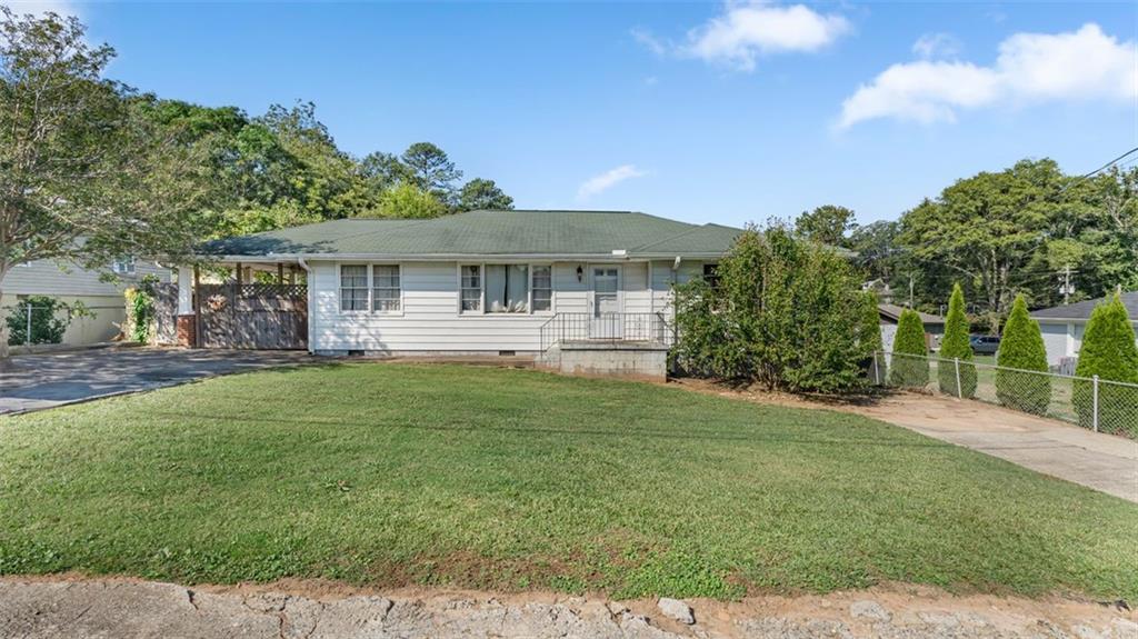 Charming 3-Bedroom Ranch in Prime Location with Customizable Potential
Step into this delightful 3-bedroom, 1-bath shotgun ranch home, perfectly positioned on a generous 0.14-acre lot amidst new upscale constructions near Smyrna Market Village and The Battery. Built in the 1950s and spanning 1172 sq ft, this home combines historical charm with a layout ready for modern updates.
Upon entry, the dining room seamlessly transitions into a cozy family room, highlighted by a built-in bookcase and disappearing attic steps for additional storage. The kitchen is well-equipped with essential appliances, including a dishwasher, microwave, electric oven, and refrigerator, set against tile countertops. The third bedroom, which doubles as a laundry and mudroom, features built-in cabinets and vinyl flooring over original hardwood. French doors in this room open to a deck and the large backyard, offering a private outdoor retreat.
The primary bedroom is notably spacious for its era, and alongside the second bedroom, it maintains the original hardwood floors found throughout the house. The home is efficiently climate-controlled with central air, an additional window unit in the primary bedroom, and a heat pump.
Outside, the property boasts a fenced-in backyard with a wooden and chain link fence, a detached garage with extra attic space, and a carport with a level, kitchen-level driveway.
Situated with public utilities and paved road access, and located near the Braves Stadium, shopping, dining, transportation, and entertainment, this home is as practical as it is appealing. It’s a gem waiting to be polished, offering a perfect canvas for those looking to infuse a classic home with their personal touch or to enjoy a superbly located, comfortable dwelling.
A Note on Potential: Like finding a rare book in a stack of magazines, discovering 2450 Davis Dr could be your chance to create a unique haven in the heart of Smyrna, brimming with possibilities for both homeowners and investors alike.