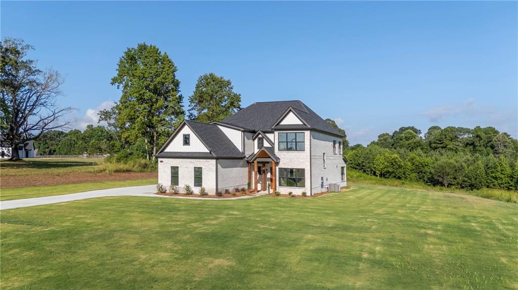 JEFFERSON CITY SCHOOLS! This brand-new custom estate defines refined living—expertly built with high-end finishes, thoughtful design, and total freedom on 3+ acres with no HOA. Enjoy the privacy of country living paired with upscale features and award-winning Jefferson schools.
Inside, nearly 4,000 sq ft of luxury welcomes you—soaring ceilings, rich hardwoods, upgraded windows, and detailed trim. The chef’s kitchen features custom cabinetry, quartz counters, high-end appliances (complete with matching 48 inch fridge), a huge pantry with coffee bar, and a massive island.
Each bedroom includes a private bath and custom closet built-ins—no wire shelves here. The spa-like primary suite offers a soaking tub, frameless glass shower, dual vanities, and two walk-in closets with full custom shelving.
Upstairs: 3 oversized bedrooms, a media room, home office, and a second laundry room.
Outside, bring your RV or boat—the oversized concrete pad is ready. Want a pool? Detached garage? Garden? You’ve got the space and freedom to do it all.