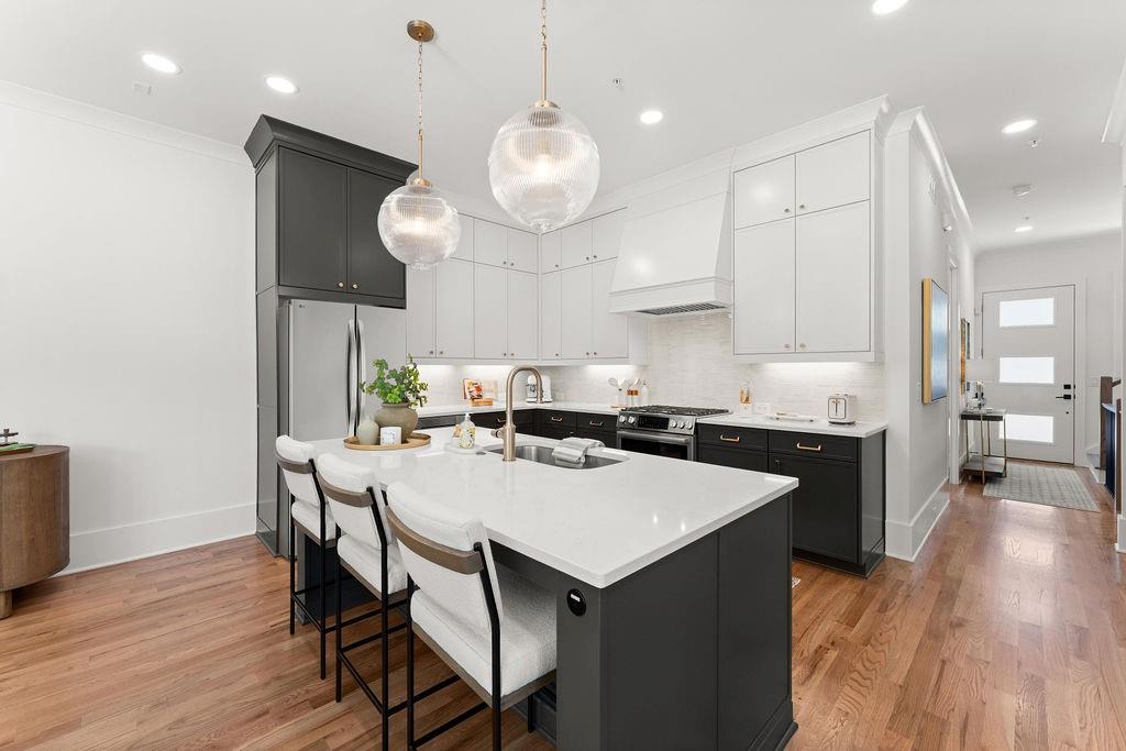 NEW CONSTRUCTION by Bercher Homes. CLOSE TO THE MARIETTA SQUARE *MOVE-IN READY* Discover Luxury Living at The Carlyle. This END UNIT is perfectly located near Kennestone Hospital, Downtown Marietta, and with easy access to the interstate. The Carlyle offers the ideal blend of convenience and sophistication. Features You’ll Love include...Site-finished hardwood floors in the main living areas, Stainless steel Bosch appliances, sliding doors that lead to a private deck, and a beautiful trim package throughout. This home is prepped for a future elevator! Come see the BEAUTIFUL finishes chosen for this home. You will enjoy WHITE GLOVE SERVICE from Phoenix Systems that includes a Video Doorbell with Analytics and WIFI Extender, WIFI Thermostat, and WIFI Liftmaster Garage Door Opener. We provide a 1-year builder warranty and an 8-year structural warranty. The Community Association takes care of your yard maintenance and allows you extra time to explore Marietta. Take advantage of our low Introductory Price and put this home under contract today. The decorated Model Home is available to tour by appointment.