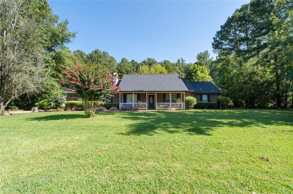 Well maintained 4 bedroom 2 bath ranch. Vaulted ceilings in great room and master bedroom. Detached 1 car garage in addition to 2 car garage attached garage. Brand new roof & gutters. New extended patio. Close to award winning Ola school.