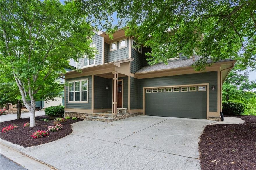 Renovated primary on main home in gated Enclave at Laura Creek with views of Noonday Creek!  2765 Prado Lane offers low maintenance living with recent renovations and HOA maintained landscaping.  The community is walkable to shopping and restaurants and provides easy access to 75/575, Noonday Park/Trail, East Cobb, Marietta Square, KSU, West Cobb, Truist Park, Downtown Woodstock, Roswell, Publix, Barnes and Noble, Whole Foods, Orange Theory, Town Center, Towne Lake, Barrett Parkway, Outlets at Ridgewalk, and more.
The main level features hardwood floors, 2 sided gas fire place, sunroom/office, updated kitchen, 10’ ceilings, large primary bedroom suite, primary bathroom with double granite vanity, walk in tile shower, jetted garden tub, primary closet with custom shelving, laundry room, large garage, powder room, and screened porch extending to renovated deck with views of creek and park. The kitchen includes painted cabinetry with upgraded hardware, granite counter tops, tile back splash, stainless steel appliances, gas cooktop, two large pantries, and island. Upstairs provides 3 large bedrooms, walk in closets, and bathrooms renovated with tile surround showers and painted cabinetry. The finished daylight basement has a large recreation room with projector screen for a home theater, additional bedroom/office spaces, storage, full bathroom with walk in shower, and opens to the covered patio with an outdoor fireplace. Additional highlights are new paint, plantation shutters, transoms, upgraded trim, hardie cement fiber board and shake exterior, newer roof, fenced backyard, community playground, and gated community.