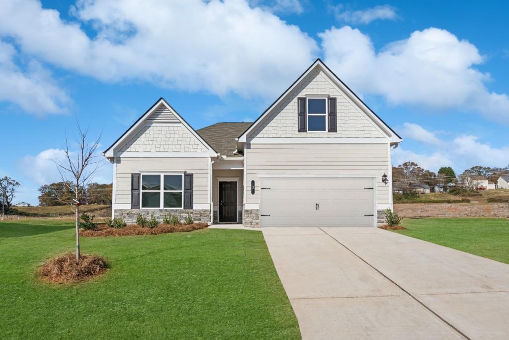 Move in Ready! The Bradley plan in the Jackson Farm community, built by Smith Douglas Homes. Jackson Farm is a swim community! This is a best-selling single story home offering four bedrooms and three full baths. The extended great room with a gas fireplace offers a welcoming gathering space with access to a large partially covered patio for effortless indoor/outdoor entertaining. The kitchen features upgraded cabinets, gas cooking, tile backsplash and granite counters. Bedrooms offer privacy, especially the owner's suite which is located at the rear of the home. The laundry room has a convenient door connecting with the Owner's closet. Upgraded Vinyl Plank flooring in all common areas add to the flow of the home. Second story has a large bonus/bedroom with full bath ideal for a guest suite, office space etc. Both stories have nine ft ceiling heights. Buyers love the Bradley's curb appeal with its long driveway and oversized cul-de-sac homesite. Photos are representative of plan not of actual home to be built. Ask about seller incentives with use of preferred lender.