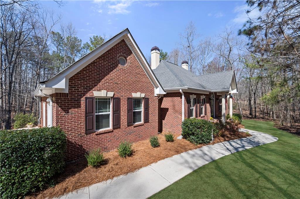 Welcome Home to this hard-to-find Four-Sided Brick Ranch Home on a Full Finished Basement located on 6.23 Acres! Custom built by Original Owners with attention to detail. Meticulously maintained! You will Love the Large Screened Porch overlooking Your Very Private Backyard. One-level Living at its best with lots of Natural Light, Wide Hallway, and Gleaming Hardwood Flooring. Arch Window and Cathedral Ceiling accent Entry Foyer. Elegant Dining Room perfect for hosting Holiday Gatherings. Warm inviting Kitchen with Breakfast Area and Expansive Windows with View of Backyard. Family room with cozy Fireplace for cool Fall and Winter Days. Spacious Primary Suite on Main with Cathedral Ceiling and Display Shelving. The Adjoining Ensuite features a Double Vanity, Jetted Tub, and a Separate Shower. Two additional Large Secondary Bedrooms on Main. Multi-Function Full Finished Basement is an Entertainer's Dream. A huge Recreation Room where Friends and Family will want to gather to enjoy the upcoming Football Season. This versatile space features a Spacious Bedroom, Bonus Room, and Full Bath perfect for a Teen or In-law Suite. Third Garage off Basement with Utility Sink is a great spot to store Gardening Tools/Lawn Equipment and more. Your Private Escape yet convenient to I-20, retail-rich Douglasville, Dallas, and more. South Douglas Elementary, Fairplay Middle, and Alexander High School. Close by you will find Sweetwater State Park offering Fishing, Hiking, Picnic Tables and more. Winston Park includes a playground, ballfields, and tennis courts. $3400 Lender Credit with Preferred Lender. Schedule your viewing today!