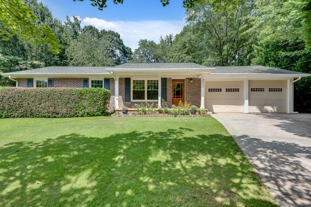Rare opportunity for a stepless, renovated ranch in a quiet cul-de-sac zoned to sought after Laurel Ridge/Druid Hills. Living is easy here inside and out, with a gorgeous open kitchen, a private owner's suite, and a true two car garage with storage. Then step outside to the huge, fenced and grassy backyard with a large patio, outbuilding, and fire pit area. Other conveniences include a fireplace in the sunny living room, a newer roof and water heater, hardwoods and double paned windows throughout, canned lighting, a laundry/mud room, and extra parking pad. All in an unbeatable location and active neighborhood - walkable to schools, shopping, and trails, and a short drive to Emory/CDC and all your intown favorites.