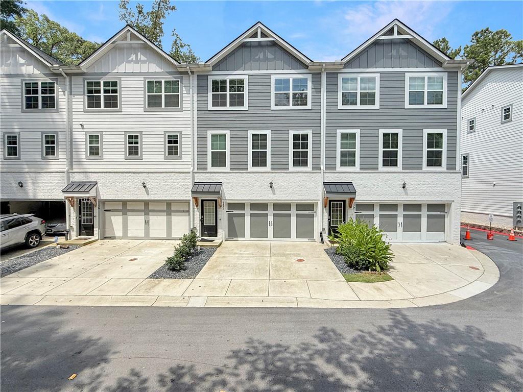 Welcome to 1160 Kendron Lane; refined urban living at The Row Townhomes. Built in 2023 by D.R. Horton, this contemporary 3-story, 4-bedroom, 4-bath home offers nearly 2,400 sq ft of smart-connected living space.
The spacious open-concept main level features hardwood flooring throughout and a central kitchen with an oversized quartz island, perfect for entertaining, as well as a large, defined dining area for formal occasions. The living room has a captivating fireplace that enhances the lounging experience, along with a powder room and access to a rear porch for additional relaxation.
Upstairs, you'll find the spacious primary suite with trey ceiling, a walk-in closet and an ensuite bath featuring a large shower, double vanity, and a private water closet. The laundry room is conveniently located on this floor, along with two secondary bedrooms that share a hall bath.
The lower level offers a light filled, versatile fourth bedroom and full bath, ideal for a home office or guest suite. This level also provides access to the two-car garage and direct rear entry.
Situated just off LaVista Road in the North Druid Hills / Toco Hills corridor, The Row offers unbeatable access to Emory University, Emory Hospital, the CDC campus, I-85, and major corridors to Midtown, Buckhead, and Downtown. Enjoy walkable proximity to local favorites like Prevail Union and Spiller Park Coffee, along with world-class global cuisine along Buford Highway, shopping at Toco Hill, and the vibrant energy of Ponce City Market. Wellness studios, farmers markets, and boutique retail are all just minutes away.
This home is ideal for professionals, academics, or anyone seeking stylish, low-maintenance living in one of metro Atlanta’s most vibrant and connected communities.