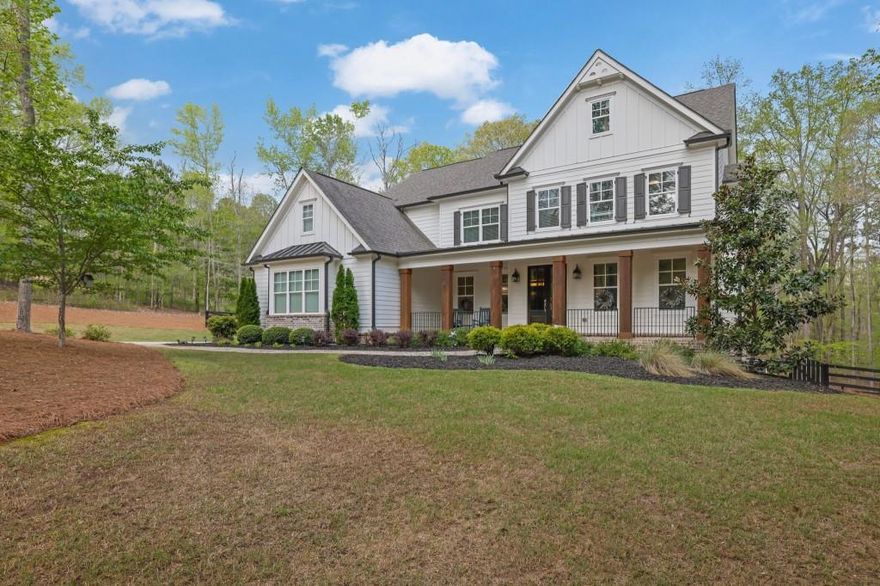 This executive home in Alpharetta is nestled on over 2 extremely private acres with low Cherokee County taxes is a must see. Situated on a cul-de-sac in the very back of a private, gated community, this elegant farmhouse backs up to a 35+ acre parcel, offering unparalleled privacy for you to enjoy your fully fenced 3 rail fenced backyard and pebble tech saltwater pool & spa. Inside, you can enjoy an almost perfect layout with an oversized quartz kitchen island open to a large living room, tucked away dining rooms and offices, as well as a mudroom and guest bedroom with en-suite bathroom on the main. Upstairs, you'll find two jack and jill secondary bedrooms, one en-suite bedroom, and a massive primary suite with an expansive closet and a double entry shower featuring 5 shower heads and a separate soaking tub in front. Full unfinished basement stubbed for bath that's waiting for your touches! Excellent public schools, and only 15min from King's Ridge Christian School as well. Make this your private oasis today.