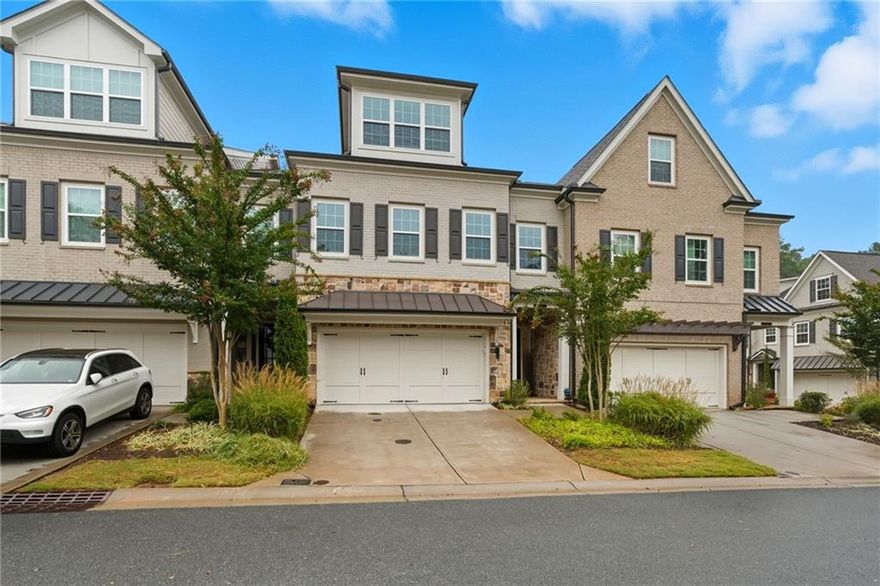 Gorgeous modern townhome loaded with upgrades! The chef’s kitchen features an oversized island, double ovens, and flows seamlessly into the spacious family room with custom built-in bookshelves and a formal dining room highlighted by coffered ceilings and a butler’s bar. Beautiful hardwood floors run throughout the home. The primary suite includes a sitting area or office space with built-in bookshelves and a luxurious ensuite bath. The third-level flex space features a built-in bar and offers the perfect area for a media room, game room, or home office—plus a fourth bedroom and full bath, creating a true “basement in the sky.” Stylish, functional, and move-in ready!