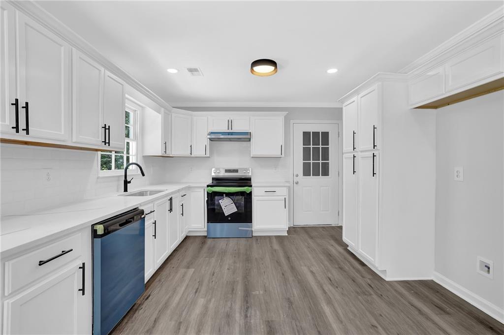 Move-in Ready & Beautifully Renovated Ranch Home! Step into this charming farmhouse-style home featuring a seamless open-concept layout perfect for modern living. The Chef’s Kitchen impresses with abundant white cabinetry, sleek quartz countertops, and an upgraded stainless steel appliance package—ideal for everyday cooking and effortless entertaining. Sit in your rocker on the covered porch or unwind in the spacious Family Room, complete with a cozy fireplace that invites relaxation. The Main-Level Primary Suite offers a peaceful retreat with a spa-like bathroom with designer touches, dual vanities, and a luxurious walk-in shower. Two additional bedrooms with a stylish bathroom, offering both privacy and convenience. Outside, enjoy your own shaded oasis—a private backyard framed by mature trees, perfect for relaxing or entertaining. Great location with easy access to 78 and great shopping just a skip away!