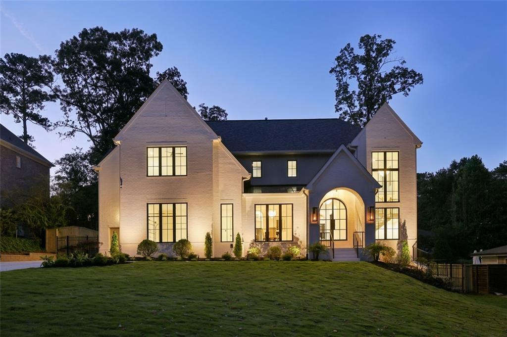 Welcome to this stunning custom home, meticulously crafted by White Oak Home Builders. Every inch of this 6-bedroom, 5.5-bath residence reflects timeless craftsmanship and refined luxury, seamlessly blending high-end design with everyday comfort. Step inside to find white oak flooring and finishes throughout, setting the tone for the home's cohesive, organic elegance. The expansive chef’s kitchen is a showpiece, featuring custom cabinetry, paneled Sub-Zero refrigerators, a Wolf range, and a full Visual Comfort chandelier and pendant lighting package that elevates every space. Casement windows fill the home with natural light, highlighting the thoughtful details and premium materials at every turn. Spa-like bathrooms boast luxury plumbing fixtures and bespoke cabinetry, creating serene retreats throughout. Outside, the Pebble Tec pool and spa offer a private oasis with full automation, perfect for effortless entertaining. The professional landscaping is both beautiful and functional, enhanced by a fully automatic irrigation system, elegant gas lanterns, and landscape lighting that adds nighttime allure. From the striking curb appeal to the sophisticated interiors, this home is a rare opportunity to own a one-of-a-kind property built to the highest standard.