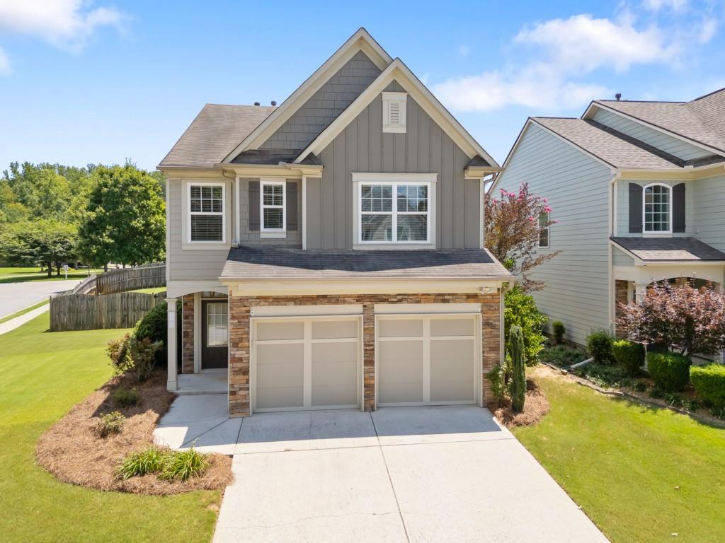 Welcome to this well-loved 3 bed / 2.5 bath home in the sought-after Stonehaven Pointe community one of North Forsyth's most amenity-rich neighborhoods. Nestled on a generous, corner lot, this home combines comfort, space, and convenience in a location that's hard to beat. Inside, you'll find fresh paint throughout, soaring ceilings, and a cozy fireplace that makes the living room instantly inviting. Full HVAC replaced in 2024 and new water heater in 2023. The kitchen offers plenty of cabinet space, and a cheerful breakfast nook that overlooks the fully fenced backyard. Upstairs, the oversized primary suite includes a walk-in closet and spacious en suite with double vanities, soaking tub, and separate shower. Two secondary bedrooms are ideal for guests, kids, or a home office setup. But what truly sets this home apart? The neighborhood. Stonehaven Pointe is a destination all its own featuring an Olympic-size pool, water slide, splash pad, multiple tennis courts, state-of-the-art gym, clubhouse, and even a dog park. Whether you're looking to beat the heat, join a tennis league, or just take an evening stroll, there's something here for everyone.