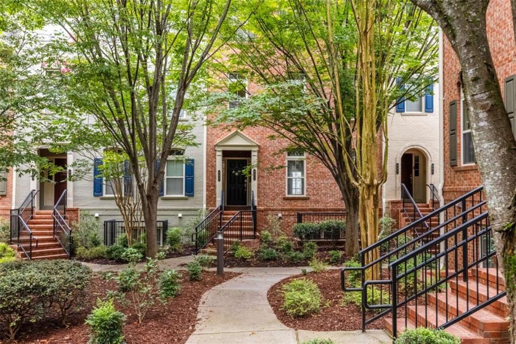Meticulously maintained brick 3-story condo in the heart of Sandy Springs. This spacious unit lives like a townhome and features oak hardwood floors, a fireside living room with built-ins, private balcony, and additional family room that overlooks a verdant courtyard. The well-appointed kitchen opens to the living room and dining room; you'll love the granite countertops, stainless steel appliances, breakfast bar, and two pantry closets. Off the family room, a hallway bar and powder room for guests offers maximum convenience. This home has great flow—the upstairs has 2 large secondary bedrooms and a generous primary suite that is the perfect retreat. The primary includes beautiful tray ceilings, a roomy walk-in closet, and tiled bath with double vanities, separate shower, and soaking tub. Two secondary bedrooms receive ample natural light and have plentiful closet space. The upstairs includes a conveniently located laundry area and linen storage. This home also features a single-car garage with storage shelves and closet, and the owner has replaced the HVAC. Promenade at Northplace is a well-maintained community of 102 homes and the most affordable newer-built community in Sandy Springs. Built in 2008, the HOA has great value and includes pool, natural gas, sanitation, termite, and exterior maintenance (including the roof!). New to Sandy Springs? This perfectly placed home straddles the Dunwoody and Sandy Springs line, so you get the best of both worlds! Enjoy the eats at Politan Row, unwind at City Springs for an outdoor concert, enjoy farm-fresh foods at the neighborhood farmer's market, and make travel and commuting a piece of cake by using MARTA. You'll love how conveniently located this home is to transit, shopping, dining, HWY 400 & 285, and everything the Sandy Springs/Perimeter area has to offer. Zoned for coveted Woodland Elementary, Sandy Springs Middle, and North Springs High School.