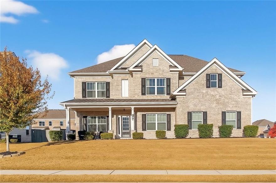 Stunning 5-Bedroom, 3-Bathroom home on a spacious Corner Lot. This beautifully maintained 4-sided brick home is located in a highly sought-after and well-kept neighborhood. Two-story foyer with hardwood floors leading to a formal dining room with coffered ceilings and a flex living room that can serve as an office. Open-concept design with gourmet kitchen featuring granite countertops, white cabinetry, stainless steel appliances, double ovens, a gas cooktop, kitchen island, and a walk-in pantry with views to a spacious two-story family room with large windows with abundant natural light and fire fireplace. Guest suite with a full bath on the main level, perfect for visitors or multi-generational living. Upstairs, the oversized primary suite. Primary bath includes a huge tiled shower, double vanities, and a huge walk-in closet. Three additional bedrooms share a Jack-and-Jill bath, plus an upstairs laundry room. Enjoy outdoor living on the covered back patio with a mounted TV, or unwind on the welcoming front porch. The side-entry two-car garage includes an electric car charger plug and plenty of storage space. Conveniently located near Cherokee Run Golf Club, I-20, shopping, dining, schools, and more.