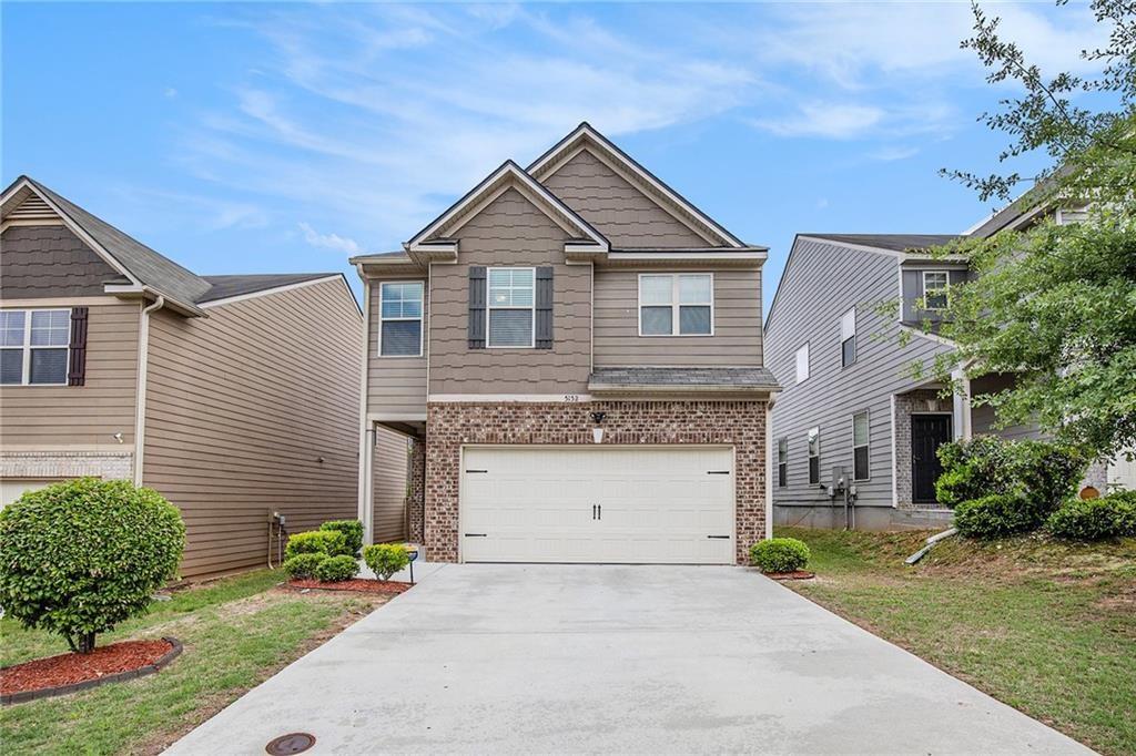 Located just minutes from S Fulton Parkway in Atlanta, GA, this 4-bedroom, 2.5-bathroom home offers a spacious and functional layout. The main level features an open floor plan where the living room, kitchen, and dining area flow seamlessly together. The kitchen includes a pantry for added storage, and a convenient half bath is also located on the main floor. Upstairs, you'll find all four bedrooms and two full bathrooms. The primary ensuite features tray ceilings, a double vanity, a soaking tub, a glass-framed shower, and a walk-in closet. Outside, enjoy a patio and a fully fenced backyard—perfect for outdoor relaxation or entertaining. Discounted rate options and no lender fee future refinancing may be available for qualified buyers of this home.