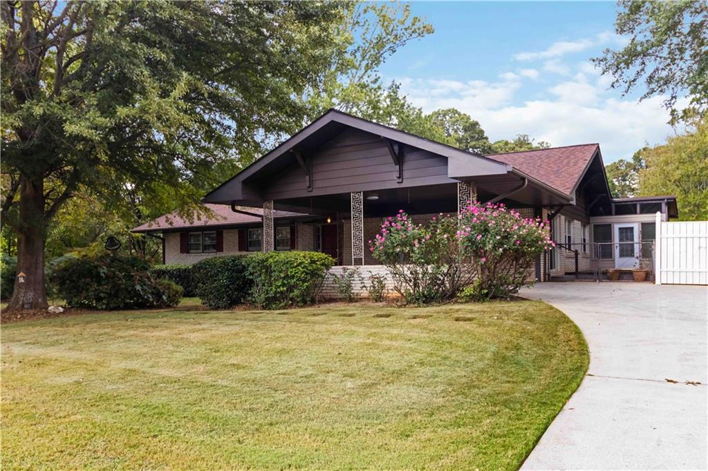 Welcome to this beautiful 3-bedroom, 2-bath ranch nestled in the heart of the sought-after City of Tucker that has been meticulously maintained and only owned by one person since the home was built. Set on a large, flat, and professionally landscaped lot, this home offers incredible outdoor space that's perfect for relaxing, entertaining, or play. Inside, you'll find generously sized bedrooms, gleaming hardwood floors, and a bright, open kitchen featuring a large island and ample countertop space that is ideal for cooking and gathering. The sunroom provides a space with plenty of natural light and ample storage to keep everything organized. Whether you're hosting in the expansive yard, grilling on the deck, or enjoying peaceful evenings in the family room with a wood burning stove, this home offers a blend of comfort, function, and charm in a family-friendly neighborhood. Just minutes from local parks, schools, shopping, and dining. This is a must-see gem in Tucker!