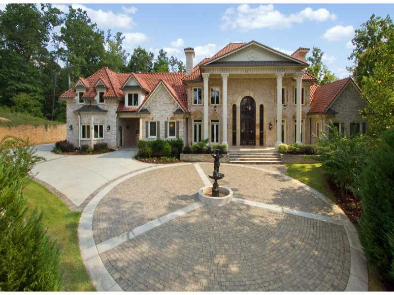 Situated just off Riverside Drive, this Custom Estate home will please even the most discriminating of buyers. Lavish details abound with three finished levels including home theater, four kitchens, heated pool, spa, sauna, steam room, and much more.. Elevator service to all levels.