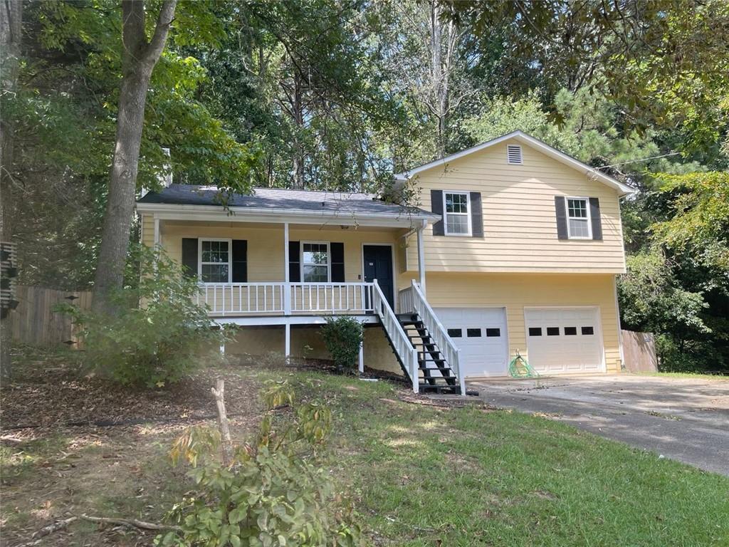 Traditional split level home located on private wooded lot in the heart of Hiram. Features include, front porch, fenced back yard, back deck, great room with stone fireplace, LVP style flooring in great room, kitchen & dining area. Kitchen with solid surface counter tops and stainless steel appliances including gas range, microwave, dishwasher and refrigerator. Upstairs you will discover 3 spacious bedrooms and 2 full bathrooms, 2 car garage. Do not miss this one.
