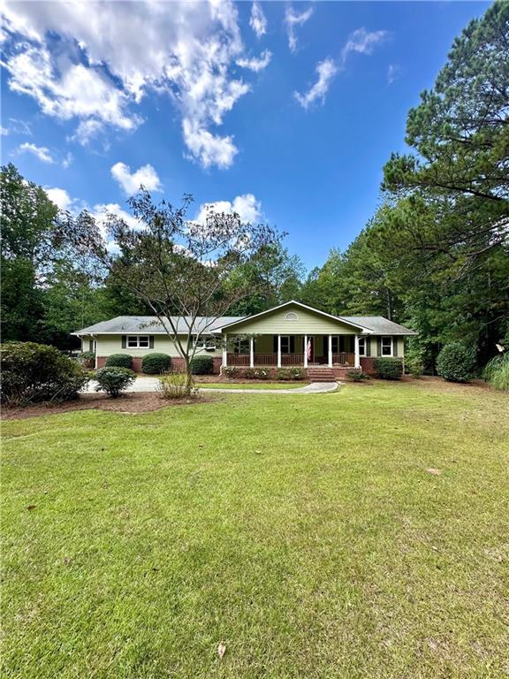 Beautifully remodeled Ranch home on full partially finished basement. 4 bedrooms 2 baths, new interior paint, LVP flooring, light fixtures, granite countertops in kitchen, appliances! walk-in pantry, Huge laundry room with sink and lots of cabinets! Spacious Country kitchen with keeping room over looking private back yard. This home sits on 5.5 private acres with an outbuilding and metal awning for great storage. Full basement with one finished bedroom could be easily completely finished by the seller at an extra cost. Seller is a licensed builder.