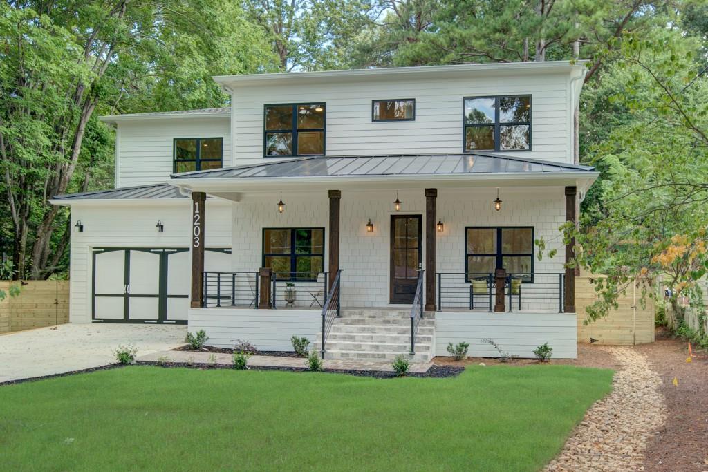 Located in the heart of Woodland Hills, this newer construction home features an open floorplan, 10’ ceilings, hardwoods throughout, outdoor living space, 2-car garage and designer finishes. Covered front porch opens to the sprawling main level featuring a spacious family room & designer kitchen. Modern kitchen features quartz counters, large pantry, white cabinetry, stainless steel appliances! Generous master suite with spa bath, large walk-in closet with custom built-ins! Large secondary bedrooms/designer baths. Close to Morningside, Virginia Highland, Piedmont Park, schools & shopping!