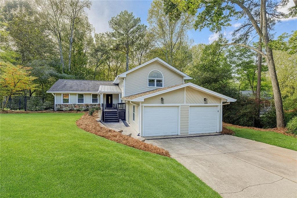 Updated & Spacious Rental in Walton High School District | Available August 1 | Can be leased Furnished or Unfurnished! Tucked away on a quiet cul-de-sac in sought-after Lake Colony, this beautifully updated split-level home offers comfort, flexibility, and top-tier schools—Walton, Dickerson, and Sope Creek Elementary. With fresh paint, new flooring, and modern upgrades throughout, this home checks every box. Step inside to find a light-filled living room, open-concept kitchen with breakfast nook, dedicated dining room, and a cozy family room that opens to a fully fenced backyard, perfect for morning coffee or evening grilling on the private patio. The versatile lower level includes a mudroom and a bonus space ideal for a home office, playroom, or media lounge.
Upstairs, the primary suite features a fully updated en-suite bath with double vanities, walk-in shower, and a custom closet system. Three additional spacious guest rooms, all with ceiling fans, 2" wood blinds, and custom closets, share an updated hall bath. Additional features include: Bamboo flooring & recessed lighting, Two-car garage with remote entry, Fruit trees on the property, Pets considered on case-by-case basis, Minimum 12-month lease, Available furnished or unfurnished! Homes like this in Walton don’t come up often—available August 1, so act fast!