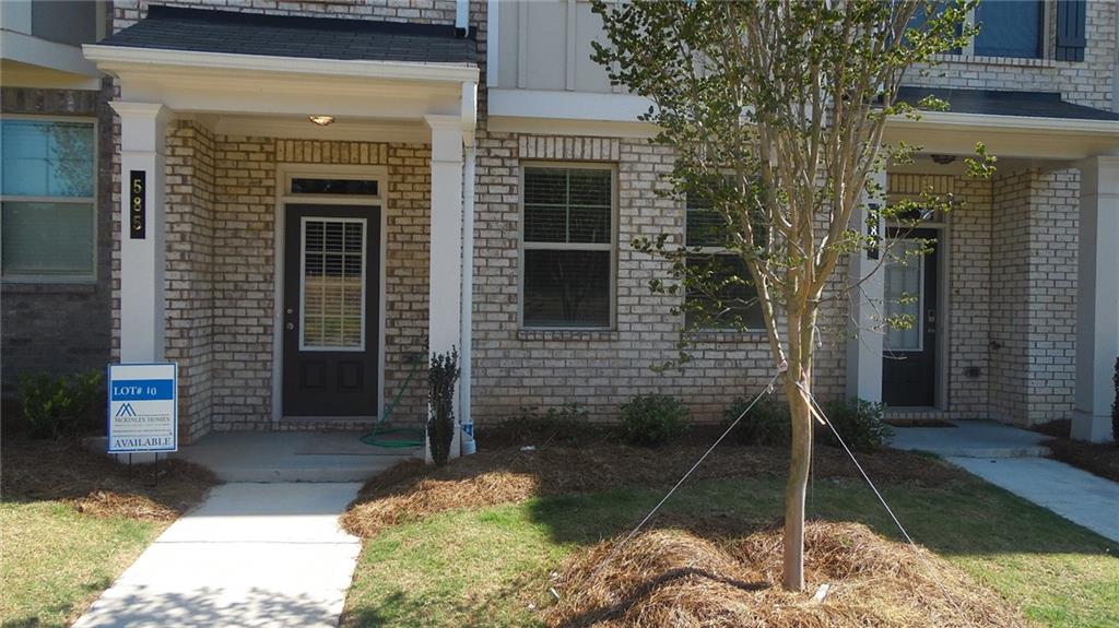 Gated Community! Move-in ready! This stunning 4 bedroom and 3.5 bathroom luxury townhouse is conveniently located in the heart of Lawrenceville. The open-concept design invites you into a well-situated well-thought-out plan that boasts exceptional features. The first level exhibits a generously sized bedroom with a walk-in closet. Also on the first level is a full-sized bathroom with granite counter, tile floor and soaking tub with tile surround. The second level showcases an oasis that features an open-concept family room with fireplace, a well-sized dining area, and a phenomenal kitchen that displays a large island with granite countertop, 42" upper cabinets with soft-close doors, and a sizeable pantry. Situated off the kitchen is a full-sized deck that is partially covered. On the third level you will find the laundry area with tile floor and shelving. Also on the third level is two good-sized secondary bedrooms and a full bathroom with granite counter, tile floor, and soaking tub with tile surround. Retire to an enormous owner's retreat that reveals a luxurious owner's bathroom that boasts double vanity with granite counter, glass shower with tile surround, separate water closet, and huge walk-in closet. This well-positioned gated community is in close proximity to the Mall of Georgia, Sugarloaf Mills Mall, and Dynamic Downtown Lawrenceville with its array of restaurants, shopping, and entertainment.