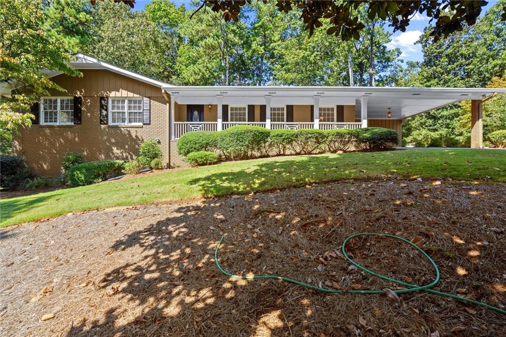 Step Inside This Beautifully Updated Ranch in Whitlock Heights
As you enter through the charming front door with its decorative glass detail, you’re greeted by a bright foyer with gleaming hardwood floors that flow seamlessly throughout the home.
The spacious den invites you in with warm natural light and a cozy brick fireplace, ideal for gathering on cool evenings. Fresh white paneling and modern recessed lighting pair perfectly with the sleek ceiling fan, creating a clean and inviting atmosphere. A door leads directly out to the deck, extending the living space into the private backyard. The backyard features a large deck to relax in the sunshine overlooking your new home.
The heart of this home is the designer kitchen. Featuring a stylish mix of rich wood cabinetry, deep navy accents, and striking patterned tile floors, this kitchen is both functional and full of character. Quartz countertops, a bold navy island with seating, and a sleek tile backsplash elevate the space. Stainless steel appliances and abundant storage—including a dedicated beverage station with under-counter wine fridge—make this kitchen a true chef’s delight.
Natural light streams in through multiple windows, framing views of the spacious backyard and filling the home with a cheerful ambiance.
Fully Finished Terrace Level
The beautifully updated Terrace Level offers a versatile living space complete with a spacious bedroom and full bathroom—ideal for a teen suite or private guest quarters. This level also features a large recreational area, perfect for a billiards table, home theater, or entertainment space. With walkout access to the back patio, it’s easy to transition between indoor and outdoor living, making it an excellent extension of the home for relaxation and fun.