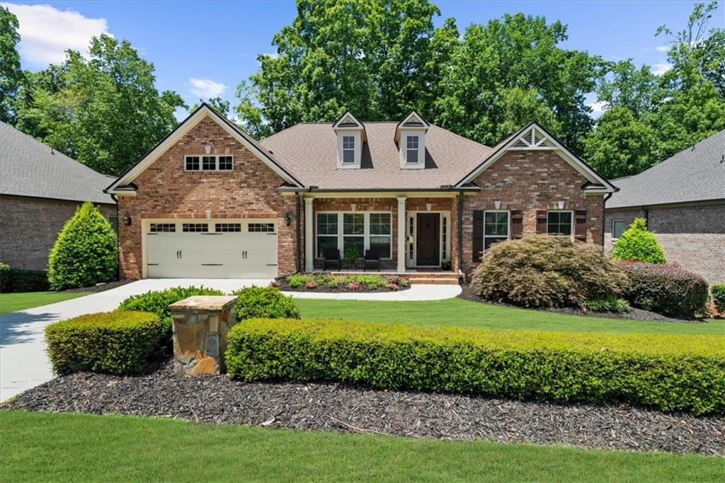 Welcome to 4930 Cecilia square, a stunning and rare 4-sided brick ranch with a finished terrace level in the exclusive and highly sought after community of Parkside at Polo Fields, a gated community of just 49 homes.This low-maintenance home offers an open layout with high ceilings, hardwood floors, detailed moldings, and upgraded lighting throughout. The spacious main-level primary suite features a luxurious bath with granite countertops, dual vanities, soaking tub, and oversized shower.The gourmet kitchen is a chef’s dream, featuring stainless steel appliances, double ovens, a gas cooktop, granite counters, and tile backsplash. Kitchen opens to a vaulted fireside family room, casual dining area, and a large deck overlooking a private, level, fenced backyard—perfect for relaxing or entertaining.On the main level: a formal dining room, versatile office/living room, powder room, and a large laundry room. The finished terrace level offers two additional bedrooms, a full bath, a workout room, and a spacious entertainment area with walk-out access to a lower deck and backyard. A sizable unfinished space provides excellent storage or potential for future expansion. Newer HVAC and roof (under 2 years old).Adjacent to the Polo Golf and Country Club, enjoy optional memberships for golf, clubhouse dining, tennis, pickleball, family and adult pools, and access to the Big Creek Greenway. HOA includes landscaping. Sought-after West Forsyth location near top-rated schools, Vickery Village, shopping, dining, GA400 & more! Don't miss the chance to make this stunning 4-sided brick ranch with finished terrace level your home!