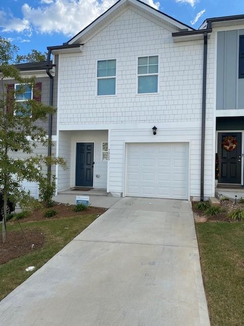 WELCOME HOME! Don't miss out on this 3 beds, 2 1/2 baths stylish townhome convenient to I20 and Stonecrest Mall! Upon entering the front door you will be met with a spacious foyer with a long hallway that leads you to an open floor plan with beautiful hardwood floors on the entire main level and tons of natural light! Kitchen offers all stainless steel appliances, fridge with ice maker, cooktop stove, sitting island and sizable pantry. Upstairs you will find roomy main bedroom with double vanity ensuite, private water closet and a generous walk-in closet! Roommate floor plan for the secondary bedrooms. Convenient upstairs laundry with complimentary washer and dryer to boot! Too much to mention! Will not last!