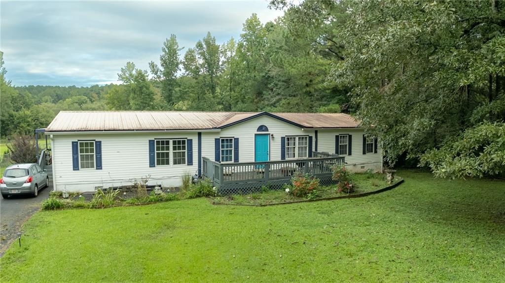 This spacious 4 bedroom, 2 bathroom retire Title mobile home offers the perfect blend of comfort and nature on almost an acre of land. Enjoy a large open floor plan with updates throughout, a split floor plan for privacy, and a luxurious master suite.
Step outside to a very large back deck overlooking your flat, fenced yard—ideal for gatherings, kids, or pets. The property also features a chicken coop, wooded lot, and direct access to the river with your own boat dock, perfect for fishing, kayaking, or boating.
Located in a quiet neighborhood, this home offers the peace of nature living while still being close to everything you need.
Fruit Garden- Fig tree, several Muscadine vines, Blueberry bush
Recently Updated-
2022 - Water Vapor Barrier, tankless water heater, All floors updated with LVP (no scratch), Asphalt driveway (partial), Asphalt double car parking pad, Septic pump replaced, several PVC pipes converted to APEX, gutters installed to exterior of home
2023 - Master closet clothing racks installed, Kitchen sink pipes replaced
2024 - Riser on Septic System, hall bathroom shower replaced with tile shower
2025 - Electrical cords in covered boxes in crawlspace