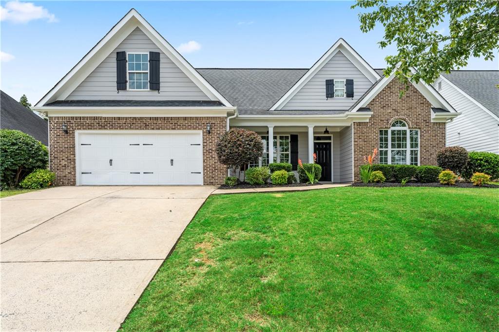 Welcome home to this stunning 4-bedroom, 2-bath stepless ranch located in the highly sought-after Four Seasons community in Cartersville. From the charming rocking chair front porch to the beautifully landscaped, fenced backyard, this home offers the perfect blend of comfort, style, and functionality.
Step inside to a welcoming entry foyer that opens to a formal dining area with trey ceilings, elegant crown molding, and an abundance of natural light. The spacious living room boasts soaring ceilings, a cozy gas fireplace, and a seamless flow into the heart of the home – the completely updated kitchen.
The kitchen is a true showstopper with new quartz countertops, a deep-fill sink, stylish new backsplash, and a brand-new stainless steel appliance package, including a low-profile microwave and refrigerator. Enjoy the privacy of a split bedroom floor plan. The owner’s suite is a retreat of its own, featuring double-door entry, vaulted ceilings with crown molding, and a luxurious ensuite bathroom with a deep jetted tub, walk-in shower, double vanity with quartz countertops, and generous storage space. This home has been thoughtfully updated with new laminate flooring, new lighting and fixtures, fresh interior and exterior paint, brand-new HVAC system, newer water heater. Outside, enjoy the fully privacy-fenced backyard complete with a covered patio, mature pear and peach trees, and vibrant landscaping—perfect for relaxing or entertaining year-round. Don’t miss your chance to own this move-in ready gem in one of Cartersville’s most desirable communities. Schedule your private tour today! Owner/Agent