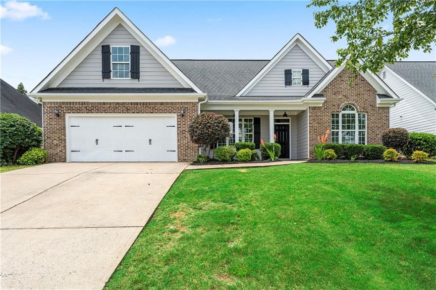 Welcome home to this stunning 4-bedroom, 2-bath stepless ranch located in the highly sought-after Four Seasons community in Cartersville. From the charming rocking chair front porch to the beautifully landscaped, fenced backyard, this home offers the perfect blend of comfort, style, and functionality.
Step inside to a welcoming entry foyer that opens to a formal dining area with trey ceilings, elegant crown molding, and an abundance of natural light. The spacious living room boasts soaring ceilings, a cozy gas fireplace, and a seamless flow into the heart of the home – the completely updated kitchen.
The kitchen is a true showstopper with new quartz countertops, a deep-fill sink, stylish new backsplash, and a brand-new stainless steel appliance package, including a low-profile microwave and refrigerator. Enjoy the privacy of a split bedroom floor plan. The owner’s suite is a retreat of its own, featuring double-door entry, vaulted ceilings with crown molding, and a luxurious ensuite bathroom with a deep jetted tub, walk-in shower, double vanity with quartz countertops, and generous storage space. This home has been thoughtfully updated with new laminate flooring, new lighting and fixtures, fresh interior and exterior paint, brand-new HVAC system, newer water heater. Outside, enjoy the fully privacy-fenced backyard complete with a covered patio, mature pear and peach trees, and vibrant landscaping—perfect for relaxing or entertaining year-round. Don’t miss your chance to own this move-in ready gem in one of Cartersville’s most desirable communities. Schedule your private tour today! Owner/Agent