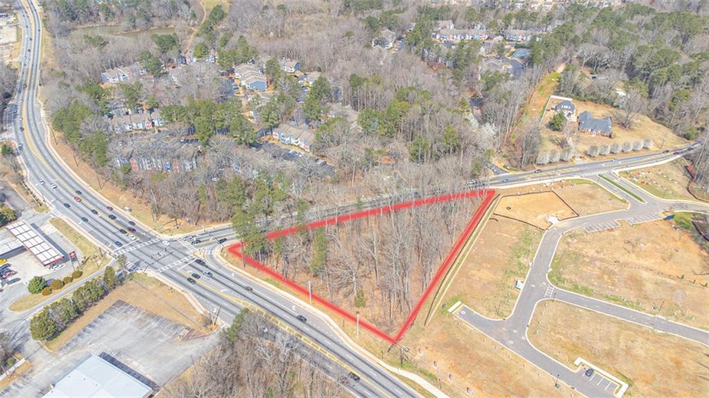 Prime commercial development opportunity on Covington Highway in DeKalb County. This ±1.81-acre site consists of two parcels being sold together: 5646 Covington Hwy (Parcel ID: 16 006 03 001) and 5650 Covington Hwy (Parcel ID: 16 007 02 013). Located in the Greater Hidden Hills Overlay (Tier 1), the property is ideally positioned at the signalized intersection of Covington Hwy and Young Rd.
