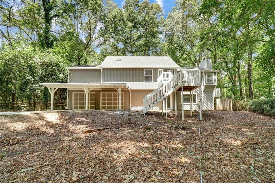 Nestled just 3 miles from downtown Roswell, this conveniently located property blends modern finishes with expansive, flexible living areas designed for everyday living and weekend gatherings. No HOA. Major renovation was completed in 2021. The living area is flooded with natural light from large windows and overhead skylights, creating a warm, airy atmosphere. Family room opens to the kitchen and offers clear sightlines to the backyard and pool. This listing offers five generously sized bedrooms, four full baths, and a large bonus room that can be convertible to a sixth bedroom, home office, or media lounge. Bonus room is complete with a separate kitchen and a full bath, suitable for in-law suite. Practical spaces are abundant— an expansive living room on each of the two levels, two laundry rooms with space for folding and storage, lower level has kitchenette, bonus room has second kitchen, outbuilding for storage, covered patio on lower level, wraparound deck on main level, and so much more. Outdoor space features a sparkling in-ground pool, with a private backyard, suitable for relaxation, everyday retreat and lively poolside entertaining. Schedule your private showing today to experience this expansive floor plan, private in-ground pool, in a desirable Roswell location!