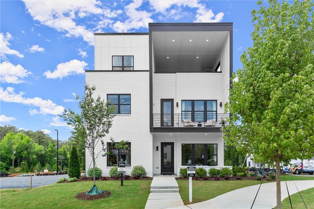 Our Model home is officially Open!! You won't want to miss our Spring Savings!!!!
Introducing the Emery Gable, a stunning New Construction Single Family home nestled in the Brand New and desirable community of The Gathering. This contemporary masterpiece showcases 4 bedrooms, 3.5 bathrooms, and an array of luxurious features including a rooftop terrace and a private elevator. Step inside this elegant home and be greeted by an open and inviting floor plan designed for modern living. The spacious living area illuminated by large windows, seamlessly flows into the dining space and gourmet kitchen. The kitchen is a chef’s dream, boasting sleek quartz countertops, high end cabinetry, kitchen aid appliances (with an optional upgrade to Wolf Appliances) ensuring both style and functionality. The main level also includes a convenient powder room and ample space for entertaining guests or enjoying family time. Ascend to the upper floors via the private elevator, a rare and coveted feature that adds a touch of sophistication and ease to everyday life. The second level is dedicated to private quarters, where you will find the luxurious primary suite. This serene retreat includes a spacious walk-in closet and a spa-like ensuite bathroom with his and her vanities, a glass enclosed shower and soaking tub. The Primary suite also features a private balcony, perfect for morning coffee or an evening wind-down, providing a peaceful outdoor escape. Two additional well-appointed bedrooms and a full bathroom provide ample space for family and guests. The crowning jewel of the Emery Contemporary is the rooftop terrace, offering breathtaking views and a perfect space for outdoor entertaining and relaxation. In addition to the rooftop, the third floor also features a fourth bedroom, full bath and a wet bar for all your guests needs. This home provides the ultimate in modern suburban living in a vibrant new community, just minutes from downtown Alpharetta, Avalon, and top-rated schools as well as prime access to the Alpha Loop. Enjoy our community amenities such as a Community Garden, Firepit and Dog Park. Experience the perfect combination of style, comfort and convenience!! This home is estimated to be complete by May 2025. Agent is on-site 7 Days a Week. Photos represent the Model home, not actual unit. Floorplan is the same, design selections may vary.