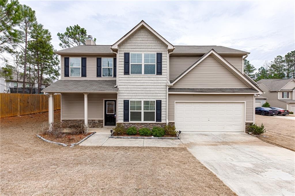 Welcome home to this craftsmen beauty that boasts a large open floor plan, chef kitchen with island, granite counter, lot of cabinet space, separate dining room, a spacious living area that opens to kitchen/ breakfast area. Large walk in pantry. Private fenced backyard and upstairs greets you with a large master suite complete with trey ceilings, a large walk in closet, double vanity, and a separate tub shower. Located in the highly sought after North Paulding school district. This home will not last, come take a look today!