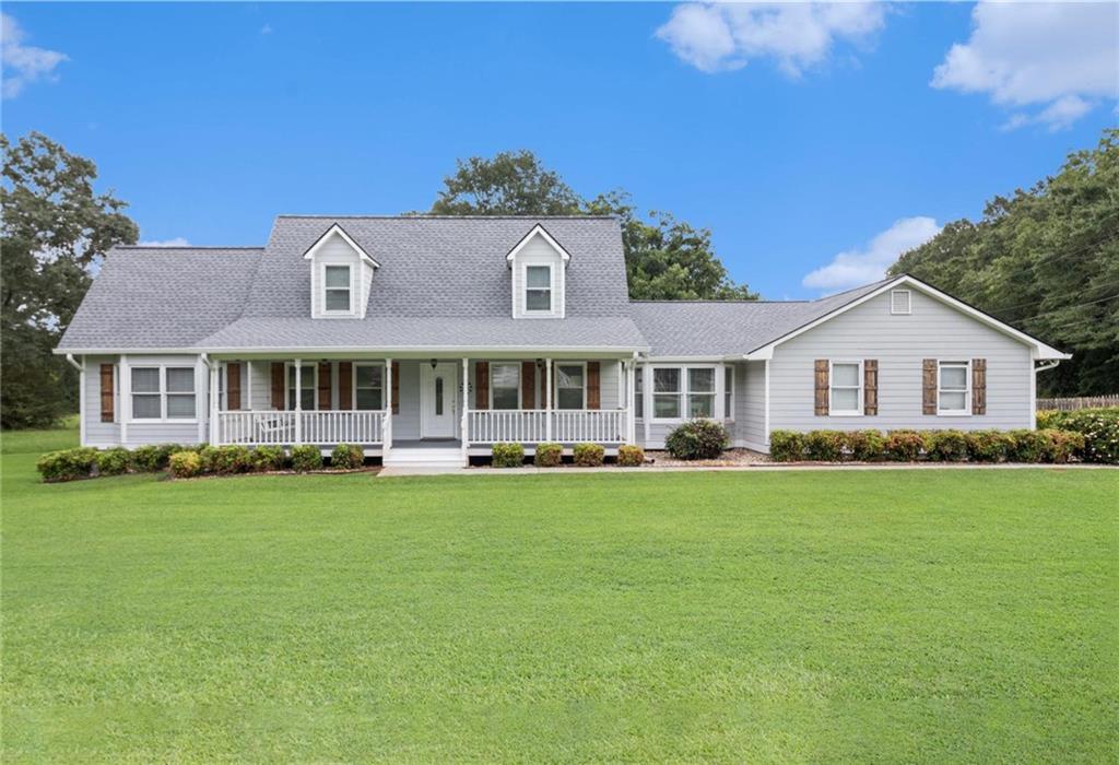Charming Cape Cod Retreat with Dual Master Suites on 1.33 Acres! An exceptional 4-bedroom with large bonus room, 3.5-bath home nestled on a beautifully landscaped 1.33-acre lot in peaceful Moreland. From the moment you step onto the inviting rocking chair front porch, you’ll feel right at home. Inside, enjoy a spacious and sunlit family room with a cozy fireplace, perfect for gatherings. The completely renovated kitchen is a chef’s dream, featuring abundant cabinet and counter space, stainless steel appliances, and a bright breakfast room. You'll also find a private office with custom bookcases, a mudroom, and a convenient half bath on the main level. This thoughtfully designed layout boasts two master suites on the main floor, one of which includes a fireplace and a private exterior entrance ideal for guests or in-law living. A delightful sunroom offers the perfect spot to relax and take in views of your private backyard oasis. Upstairs, you’ll find three oversized guest bedrooms and a well-appointed full bath. Step outside to your brand-new oversized back deck, overlooking the sparkling swimming pool and fully fenced backyard, an entertainer’s paradise! The outdoor living space offers both beauty and privacy, making it the perfect place to unwind or host friends and family. Recent upgrades within the last five years include, renovated kitchen and baths, tankless water heater, new carpet, interior/exterior paint, new roof, updated appliances, toilets, gas logs, and a new pool liner. With all major maintenance already completed, this home is truly move-in ready! Located near shopping, great dining options, schools, and expressways, this is a rare opportunity to own a beautifully updated home with space, privacy, and charm. Don’t miss it, schedule your private showing today!