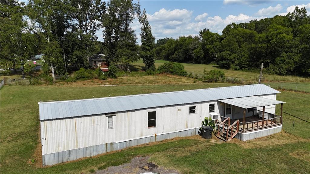 Welcome home to this charming 3 bedroom, 2 bathroom property that comes with an adjoining parcel, giving you a spacious .81-acre lot. This property offers the convenience of public sewer and water, plus peace of mind with a newer roof. Enjoy the privacy of a fenced yard, perfect for pets, family, or gardening. Ideally located just 15 minutes from downtown Cartersville and only 10 minutes from I-75, this property combines quiet living with quick access to shopping, dining, and commuting routes. The adjoining lot also has power & water creating an opportunity for building another home! Don’t miss this opportunity—schedule your showing today!