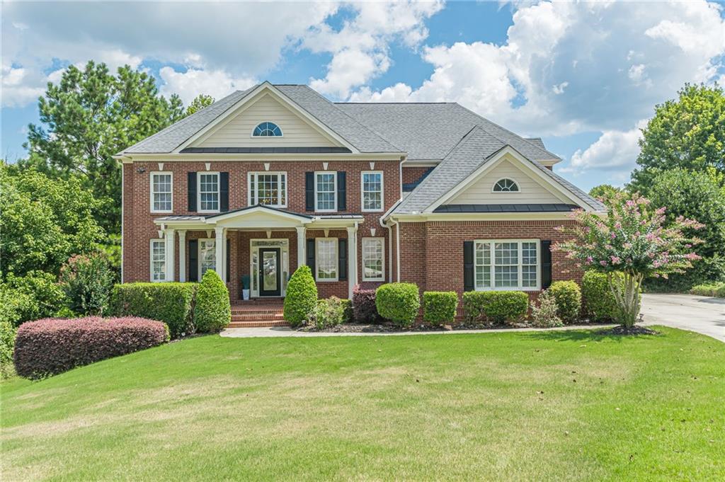 Exquisite Custom Home on Golf Course Lot in Premier Swim/Tennis Community! Beautifully maintained two-story home offers elegance, comfort, and style. Stunning foyer opens main level featuring an elegant living room and formal banquet-sized dining room perfect for entertaining. The gourmet kitchen is truly a chef's dream with all new appliances, boasting an oversized island, breakfast bar, and sunny breakfast room with views of the lush backyard and beautiful pebbletec gunite pool. The luxurious owner's suite on main floor includes a spa-inspired bath for ultimate relaxation. Upstairs, you'll find generous secondary bedrooms and well-appointed baths. The finished terrace level offers even more living space, complete with two additional bedrooms, a full bath, and views of the beautifully landscaped backyard overlooking 3rd hole on the golf course. Complete with new HVAC. Located in a sought-after community with swim/tennis amenities, and convenient to the Atlanta airport, shopping, and more this home truly has it all!