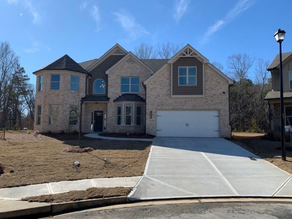 CHARLESTON Plan Lot 74: 5BR/4BA, HOME CAN CLOSE QUICKLY! $5,000 TOWARDS CLOSING COST WHEN YOU USE THE PREFERRED LENDER, ARCH CAPITAL. Come Take a Look at This Beautiful Home enjoys Upgrades Galore! Located in the Sought after MILL CREEK School District. This HOME is Located in the Hamilton Mill Area with Great Shopping, Parks and Schools. This Lot is Level in the Front, Very Private Back Yard with MASSIVE VIEW. The Main Level Features a 2-Story Foyer, Formal Coffered Dining Room, Study/Flex Space, Large Bedroom on the Main with Spacious Walk-In Closet and Full Bath. Gourmet Kitchen with 42" White Cabinets, Huge Walk in Pantry, Double Wall Ovens, Electric cooktop, vented microwave, Dishwasher, one Continuous Stainless-Steel Sink with Disposal, Island with lots of Seating, and Tile Backsplash. The main level has Tons of Hardwood and the Wood Staircase lead you to a Wonderful Media Room and 4 bedrooms. 2 Bedrooms share a Jack and Jill Bathroom, One Bedroom with Ensuite Bath.The Master Bath alone Deserves Special Mention, this Space Includes Comfort-Height Double Sink Vanity, Oversized Walk-in Shower, Separate Soaking Tub, Linen Closet, and Private Water Closet. You will Love to Enjoy Your Coffee on the Covered Back Porch Over Looking the Forrest. If You Like Nature, You Will Love This Back Yard. Sides are fenced for extra privacy. Cul De Sac Lot.