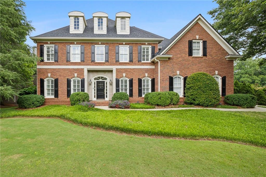 Beautiful Historic Brookhaven home with 5 bedrooms and main level master bedroom with high ceilings!