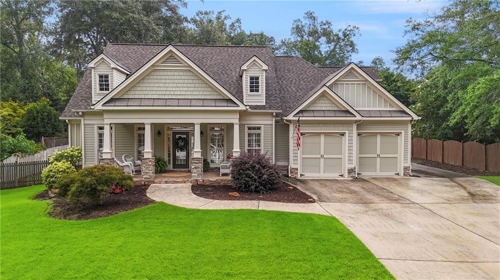 This stunning Craftsman-style home sits on a beautifully landscaped, level 1/3 acre lot in one of Marietta’s most sought-after locations. Just a short stroll to Historic MARIETTA SQUARE and zoned for WESTSIDE ELEMENTARY, this property blends timeless charm with modern convenience.
Step inside to an open floor plan designed for comfortable living and entertaining. The gourmet kitchen boasts a large center island, abundant cabinetry, and not one but two pantries—perfect for the avid cook. Enjoy gatherings in the separate dining room or relax in the living room with custom built-in bookcases, coffered ceiling and a cozy fireplace.
The OWNER'S SUITE on the MAIN LEVEL features a spacious bedroom, large master bath with double vanity, separate spa tub and large walk-in closet. Two additional main-level bedrooms, set on the opposite side of the home for privacy, share a full bath with tub/shower.
Upstairs offers a versatile suite ideal for an office or playroom, additional den or another large bedroom with a full bath, walk-out attic, and a large storage closet.
Outdoor living is a dream with a SCREENED PORCH, large deck, and a FENCED BACKYARD that’s both private and level—perfect for pets, play, and entertaining. A separate storage shed adds even more functionality. The two-car garage with a side driveway perfect for a boat or RV completes this exceptional property. This one is a must see!