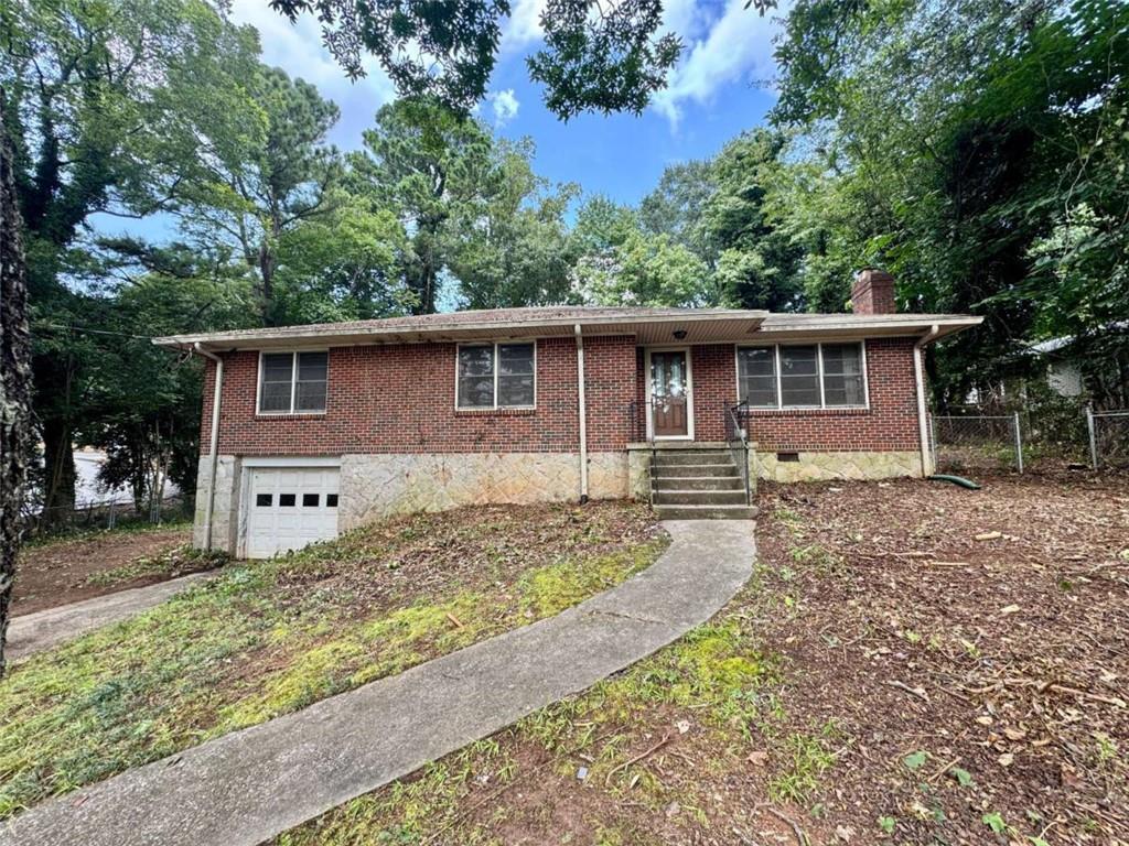 Rare Fixer-Upper truly in the heart of Toco Hills/ North Druid Hills at an unheard of price in the $300s! This raised brick ranch offers an exceptional 2,325 square feet of potential living space, including 1,641 finished square feet upstairs and 684 square feet of unfinished basement space ready for customization. The basement currently includes a 1-car garage, a rare feature in this age home, ideal to keep as parking and still have a finished bonus room in the basement, or convert the garage into a 4th bedroom plus bonus room for expanded living space. The home sits on a large, cleared, fenced half-acre lot, with plenty of room to the left of the home for a carport, garage, or an addition, adding even more value and versatility. Inside, you'll find a spacious fireplace family room and formal living room that can be opened up to the kitchen to create a modern, wide-open floor plan perfect for today's living. Original hardwood floors run throughout the main level, and the home is easily convertible into a two full bath layout, maximizing both function and resale value. Located at the center of Toco Hills, check the map to see how close this this property is to the Toco Hills shopping plaza and Publix, and only 1 mile ~30 min walk to Emory University and the VA Hospital. A clear septic inspection letter is in hand, making this property ideal for real estate investors or homeowners using a renovation loan to create their dream home in a highly sought-after location. Opportunities like this are incredibly rare-don't miss your chance to unlock serious upside in a premier neighborhood at an unbeatable price.