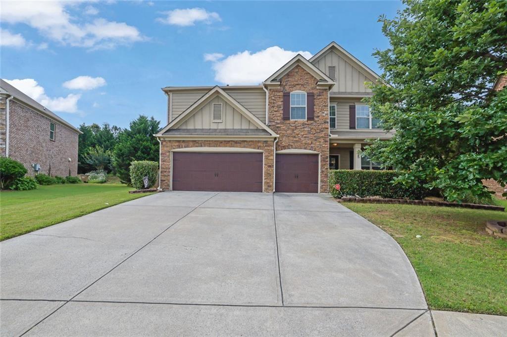 Welcome to 425 Eldridge Dr, a beautifully maintained, move-in ready 3-sided brick home nestled in the highly sought-after Nichols View subdivision of Suwanee! This spacious 5-bedroom, 4 full bathroom residence with a 3-car garage blends timeless curb appeal with modern comfort, all within one of Forsyth County's top-rated communities, and it’s priced to sell! Step inside to an inviting open-concept layout featuring LVP flooring throughout the main level. The gourmet kitchen is the heart of the home, offering clear sight lines into the family room, living room, and elegant dining area with coffered ceilings. A center island, gas range, and stylish tile backsplash make this kitchen ideal for cooking, entertaining, and everyday living. A guest bedroom and full bath on the main floor offer flexibility for visitors or multi-generational families. Upstairs offers four generously sized bedrooms, two versatile lofts: ideal for a media room, office, or playroom, with brand new carpet on the stairs and common areas. The oversized primary suite features a tray ceiling, private sitting room or nursery, and his-and-her walk-in closets. The spa-inspired primary bathroom includes a dual vanity, soaking tub, and separate walk-in shower. Step outside to a backyard built for relaxation and fun. Enjoy evenings on the extended patio next to the outdoor brick fireplace, while children or pets play safely in the private one-third-acre fenced yard. This house also offers a 3-car garage with EV charger for your convenience. Best of all, this home is within walking distance to the community pool and playground, offering an active lifestyle just steps from your door. Located near top-rated schools, including Lambert High, Riverwatch Middle, and Settles Bridge Elementary, plus easy access to parks, shopping, and dining, this home truly has it all. Don’t miss your chance to own this rare gem in one of Suwanee’s premier communities. Schedule your showing today! Discounted rate options and no lender fee future refinancing may be available for qualified buyers of this home.
