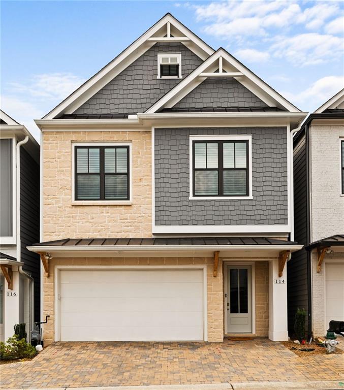 Do not miss out on an amazing opportunity to have it all! Located less than 5 minutes from downtown Woodstock, this nearly new home has all the futures you want. Located in the Villages at Towne Lake, this 3 bedroom, 2.5 bath home welcomes you with beautiful flooring, tall ceilings, and grand sized windows. The kitchen gives off designer vibes with stainless steel appliances, a herring bone backsplash, and quartz countertops. The large island looks onto the living and dining area making this home an amazing place to host friends and family. Upstairs you will find the three bedrooms. The two secondary bedrooms feature large windows and ample sized closets. These bedrooms share a guest bath with a large vanity and tub/shower combo with tile surround. The owners suite features an amazing custom closet, elegant bathroom with walk-in shower, his-and-hers vanities, and modern tile details. There is even a private covered deck. Located in a beautiful gated neighborhood, this private enclave of homes give off a Mediterranean feel and features top class amenities, including a large pool, tennis courts, private work out center, covered sitting area around the pool, and a club house for resident use. You don't even have to cut the grass as it's all included in the HOA dues. Schedule your showing today and see what its like to live the high life.