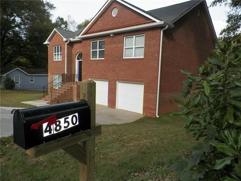 Available for immediate occupancy! Gorgeous 4 side brick home walking distance to downtown Acworth! Hardwoods and tile thru out, granite & stainless steel in kitchen, lg vaulted family room w/fireplace. Sep. dining & eat in area. Large master, mstr ba has garden tub, sep shower, double vanity. Could be 2nd master on lower level, lg bedroom,includes priv. bath & huge closet. Bonus/5th bedroom on lower level too! Oversized garage w/storage rm behind. Large deck & huge back yard. Near all conveniences yet tucked away just outside city of Acworth. Paint is agreeable gray presently.