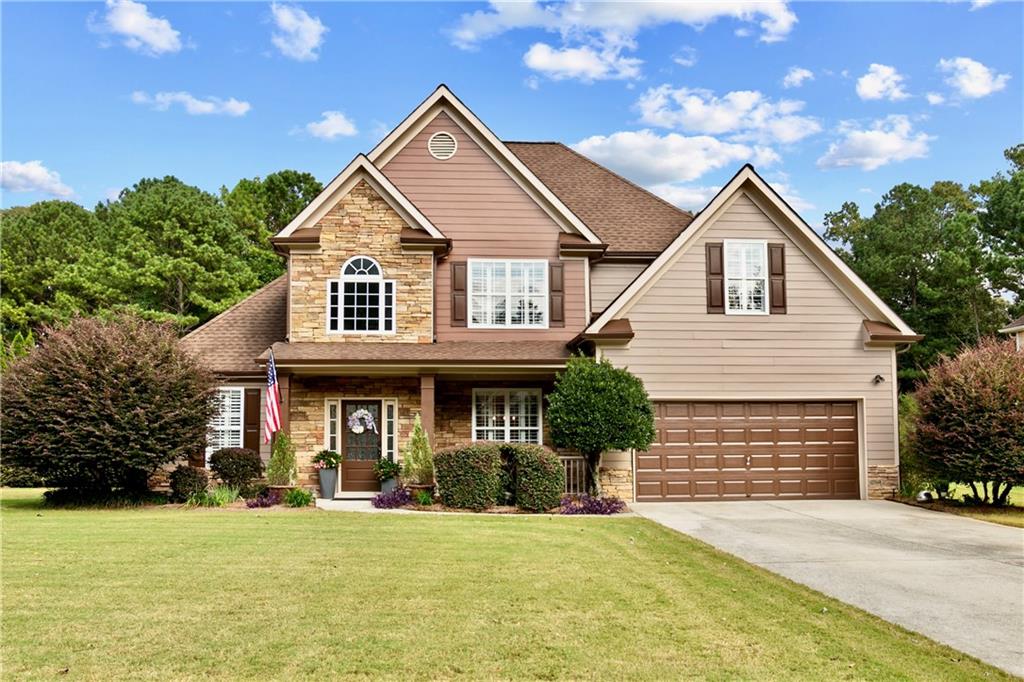 This Creekside Golf & Country Club Gem has a Primary Suite AND Second Bedroom on Main Level. Open Concept Floor Plan with a Vibrant and Modern Living Space. 4 Bedrooms, 3 Full Baths with a Large Upstairs Flex Room/Office. The Covered Front Porch, Two Story Foyer, Plantation Shutters and Hand-scraped Hardwood Floors on the Main Level welcome you. The Kitchen features Solid Surface Counters, Stainless Appliances and a Tile Backsplash. Lots of Cabinets, Recessed Lighting and a Peninsula Island complete this Perfect Entertaining Space. Separate Dining Room and Breakfast Area with Vaulted Ceiling. Spacious Two Story Family Room with Stacked Stone Fireplace and Great Natural Light. Two Bedrooms on First Floor including an Oversized Primary Suite with Large Walk-in Closet. Master Bath boasts Double Vanity, Separate Shower, Soaking Tub & Private Water Closet. Upstairs has 2 More Secondary Bedrooms with Large Walk-in Closets and a Jack/Jill Bath Setup. There is an Additional Large Flex Room Perfect for Home Office, Crafts, etc. True Walk-in Laundry Room. MUST SEE Backyard includes Beautiful Landscaping, Flowers and a HUGE Paver Stone Patio. There is a Storage Building with Power and Water. Creekside Golf & Country Club is a Manicured Golf Community with Swim, Tennis & More. Close to Dallas Highway, Shopping and Dining.